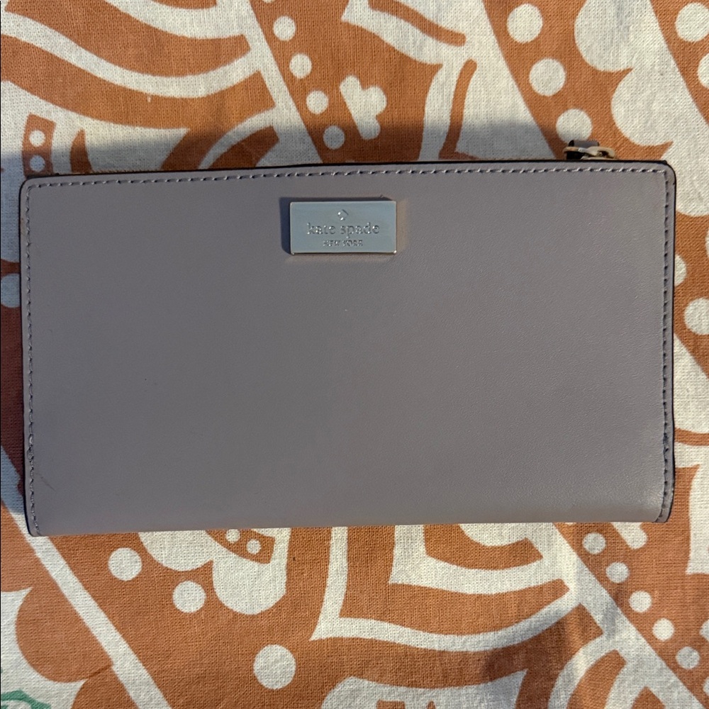kate spade lilac zip-around wallet with metal logo